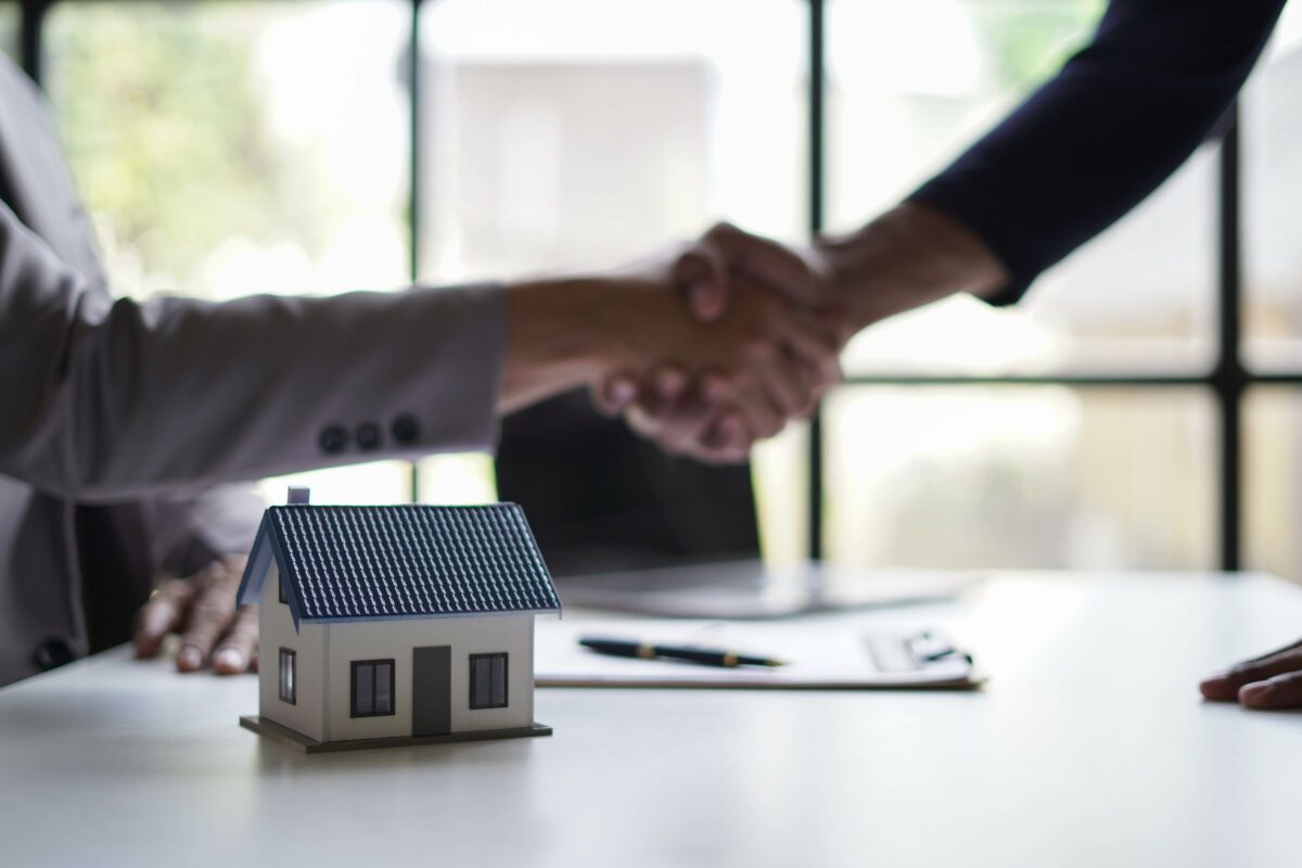 Mortgage Product expert shaking hands with client